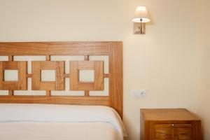 A bed or beds in a room at La Resplenda