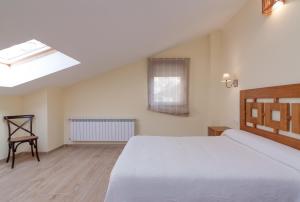 A bed or beds in a room at La Resplenda