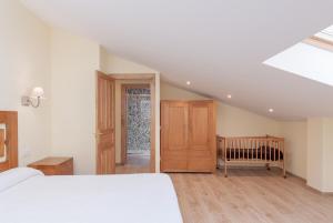 A bed or beds in a room at La Resplenda