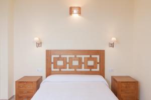A bed or beds in a room at La Resplenda