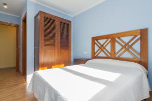A bed or beds in a room at La Resplenda