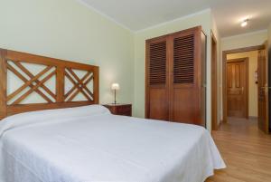 A bed or beds in a room at La Resplenda