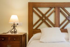 A bed or beds in a room at La Resplenda