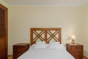 A bed or beds in a room at La Resplenda