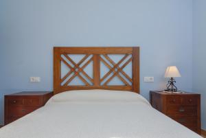 A bed or beds in a room at La Resplenda