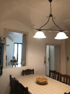a dining room with a table and a mirror at Casa Cardi in Sperlonga