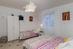 Postel nebo postele na pokoji v ubytování Apartments Lile