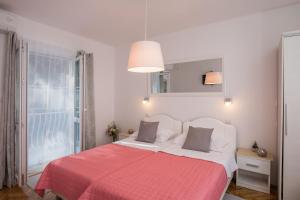 Postel nebo postele na pokoji v ubytování Apartments Lile