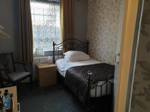 
A bed or beds in a room at The Beaumont
