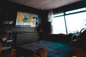 TV/Unterhaltungsangebot in der Unterkunft Galaxy Pod Hostel
