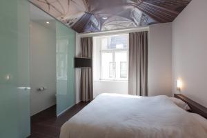 Voodi või voodid majutusasutuse Hotel Marcel toas