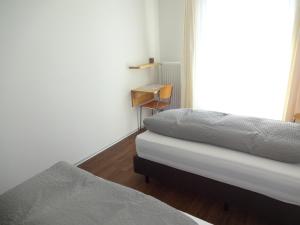 Postel nebo postele na pokoji v ubytování Burgbühl