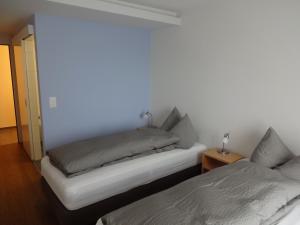 Postel nebo postele na pokoji v ubytování Burgbühl