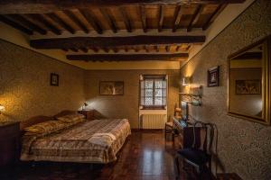 Postel nebo postele na pokoji v ubytování Relais Oroscopo