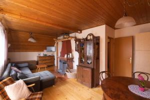 a living room with a couch and a table at House Franja - Spa and relax in Kranjska Gora
