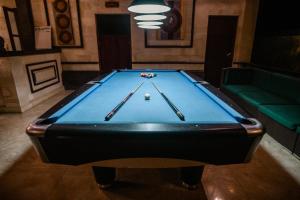 a pool table in a room with a billiard at The Hamsa in Lovina