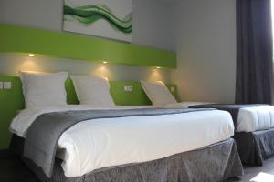 Postel nebo postele na pokoji v ubytování Hotel Esplanade