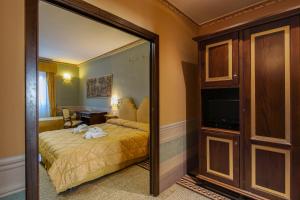 Postel nebo postele na pokoji v ubytování I Portici Hotel - Residenza D'Epoca