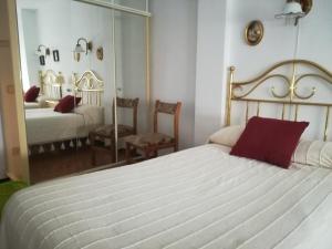 En eller flere senge i et værelse på Casamami