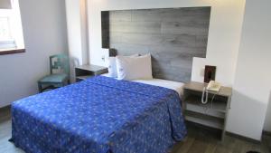 Voodi või voodid majutusasutuse Hotel Mina toas