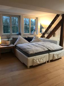 Ein Bett oder Betten in einem Zimmer der Unterkunft Leipziger Logis