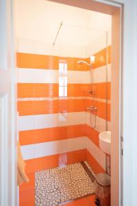 a bathroom with a shower and a sink at Fluxus Hostel in Ljubljana +21 photos