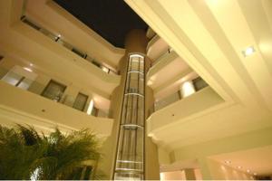 a lobby with a spiral staircase in a building at Home 15 Residence in Catania