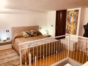 a bedroom with a bed in a room at La Dimora del Viaggiatore Luxury Apartments in Mazara del Vallo