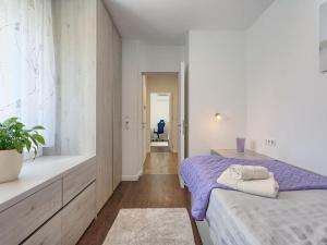 Posteľ alebo postele v izbe v ubytovaní Vacation Home Bokan