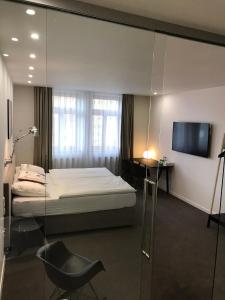 Posteľ alebo postele v izbe v ubytovaní Rozmaryn Hotel B&B