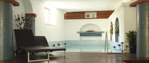 a living room with a swimming pool and a bench at Hotel La Scogliera in Ischia