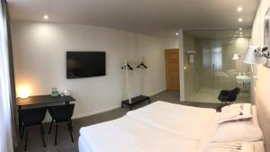 Posteľ alebo postele v izbe v ubytovaní Rozmaryn Hotel B&B