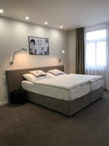 Posteľ alebo postele v izbe v ubytovaní Rozmaryn Hotel B&B