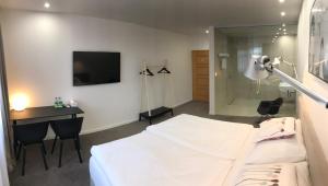 Posteľ alebo postele v izbe v ubytovaní Rozmaryn Hotel B&B