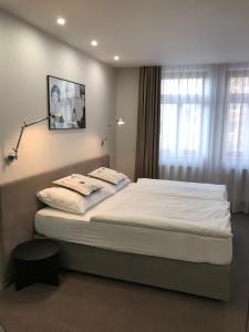 Posteľ alebo postele v izbe v ubytovaní Rozmaryn Hotel B&B