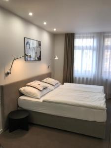 Posteľ alebo postele v izbe v ubytovaní Rozmaryn Hotel B&B