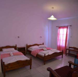 A bed or beds in a room at Pension Christina
