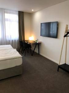 Posteľ alebo postele v izbe v ubytovaní Rozmaryn Hotel B&B