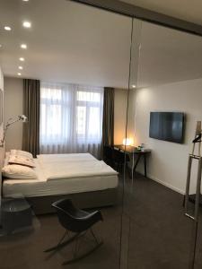 Posteľ alebo postele v izbe v ubytovaní Rozmaryn Hotel B&B