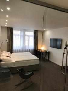 Posteľ alebo postele v izbe v ubytovaní Rozmaryn Hotel B&B