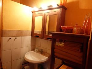 a bathroom with a sink and a mirror at Aperi View in Karpathos