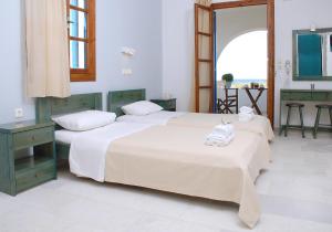 Postel nebo postele na pokoji v ubytování Bluefox Apartments