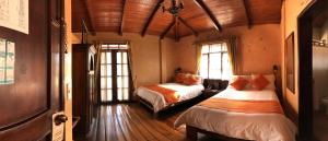 Voodi või voodid majutusasutuse Kitu Hotel toas