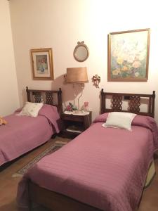 Postel nebo postele na pokoji v ubytování Casa Madonna Boschi