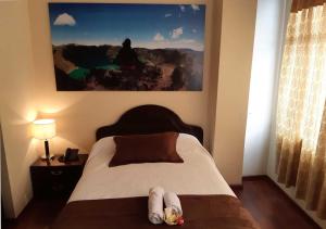 Letto o letti in una camera di La Merced Plaza Hospedaje
