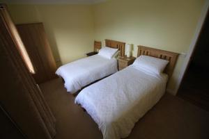 Кровать или кровати в номере 1bayhead Lingerbay