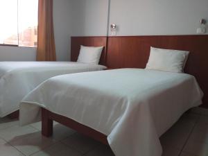 Postel nebo postele na pokoji v ubytování Hostal Vasco
