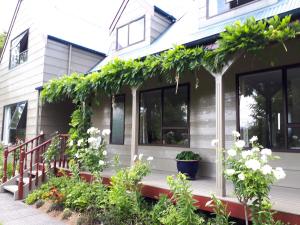 a house with plants on the front porch at Rangaroa Heights in Taumarunui