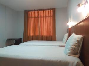 Postel nebo postele na pokoji v ubytování Hostal Vasco