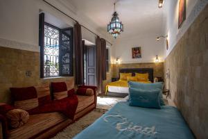 Postel nebo postele na pokoji v ubytování Riad Ciel d'Orient